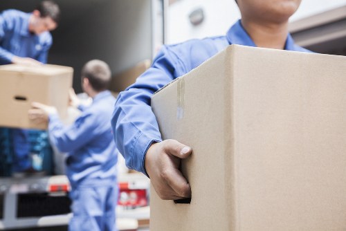 Workers separating recyclable materials at Battersea Storage