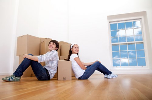 Expert movers packing fragile household items in Battersea