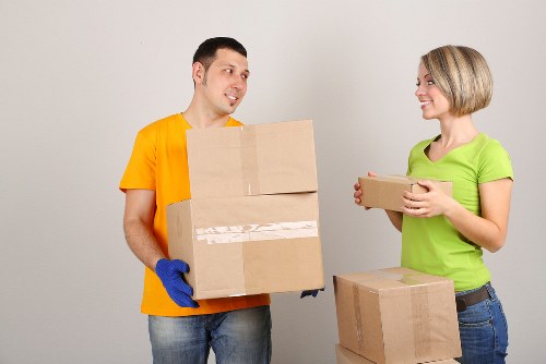 Small removals team transporting office items in Battersea